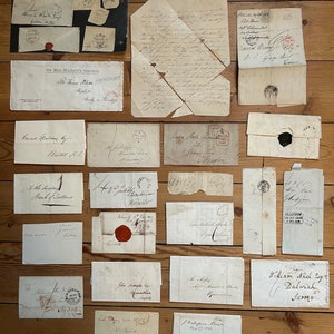A collection of early pre-stamp GB postal history letters and postmarks dating between 1798 - 1847 some with wax seals