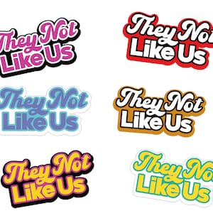 May include: Six colorful stickers with the text "They Not Like Us" in a retro font style. The stickers are in pink, red, blue, yellow, orange, and green.