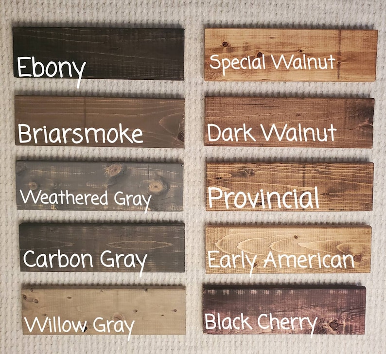 May include: A collection of stained wood samples in various colors. The samples include Ebony, Special Walnut, Briarsmoke, Dark Walnut, Weathered Gray, Provincial, Carbon Gray, Early American, Willow Gray, and Black Cherry. Each sample has the color name in white text.
