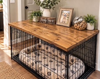 May include: A black metal dog crate with a thick wooden top surface. Inside the crate is a beige oval pet bed with a dark paw print pattern. On top of the wooden surface sits a sign that reads Family Time, a picture frame, and a glass jar.