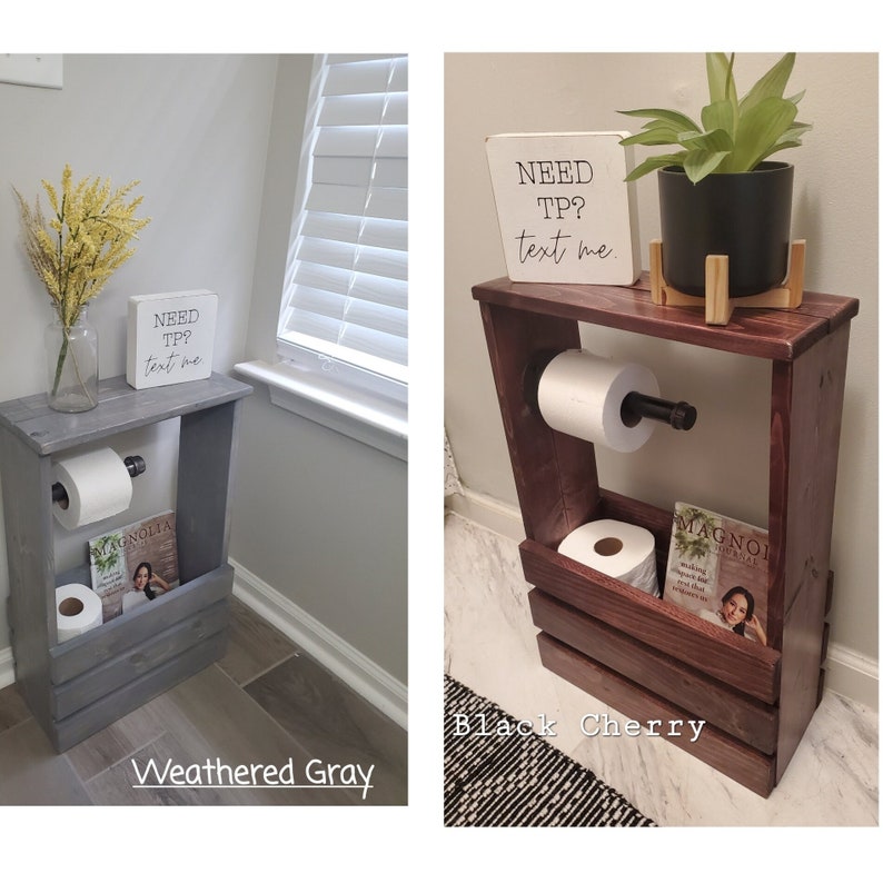 May include: Two wooden toilet paper holders, one weathered gray and one black cherry. Each has a shelf for magazines and a sign that says "NEED TP? text me." The black cherry holder has a plant on top.