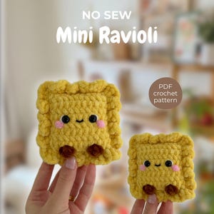 May include: Two yellow crochet ravioli with smiling faces and brown feet. The text "NO SEW Mini Ravioli" is above the ravioli. A small circle reads "PDF crochet pattern".