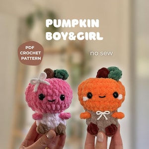 May include: Two crocheted pumpkin figures, one pink and one orange, with smiling faces and small arms and legs. The pink pumpkin has a white bow and the orange one has a brown outfit. Text reads "PUMPKIN BOY & GIRL" and "PDF CROCHET PATTERN".