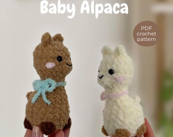 May include: Two crocheted baby alpaca figures, one brown with a light blue bow and one cream with a pink collar. Both have dark eyes and pink cheeks. Text reads: NO SEW Baby Alpaca and PDF crochet pattern. The figures are made of textured yarn.