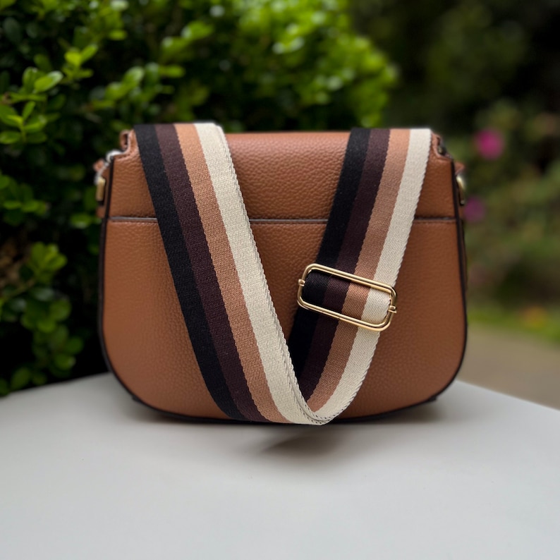 Make any purse, cell phone holder, or camera stylish with this stripe pink beige rose mauve blush black rust orange brown khaki tan sage olive army green blue aqua turquoise forest pine strap gold hardware. This guitar style Boho strap crossbody.