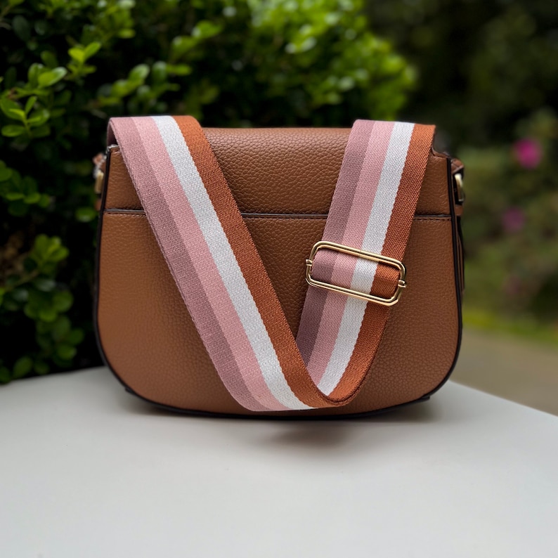 Make any purse, cell phone holder, or camera stylish with this stripe pink beige rose mauve blush black rust orange brown khaki tan sage olive army green blue aqua turquoise forest pine strap gold hardware. This guitar style Boho strap crossbody.