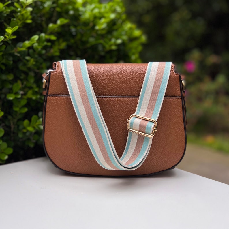 Make any purse, cell phone holder, or camera stylish with this stripe pink beige rose mauve blush black rust orange brown khaki tan sage olive army green blue aqua turquoise forest pine strap gold hardware. This guitar style Boho strap crossbody.