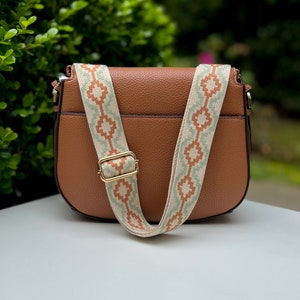 Make any purse, cell phone holder, or camera stylish with this chevron checkered aztec stripe natural cotton canvas beige tan khaki taupe sand bone cream olive army green red brown embroidered. This guitar style Boho strap purse or bag a crossbody.