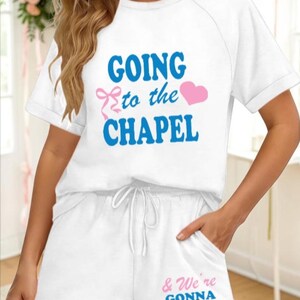 May include: White pajama set with the text "GOING to the CHAPEL" in blue and a pink heart and bow. The shorts have the text "& We're GONNA GET MARRIED" in blue and a pink heart. A bridal theme.
