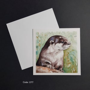 Otter am Flussufer - 15x15cm Grußkarte. Gehämmerte 300g Karte mit weißem Umschlag.