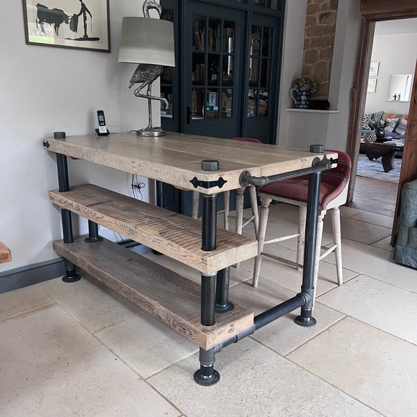 Kitchen Island Bespoke and rustic, Chunky Vintage reclaimed wood set on thick industrial pipe with iron attachments