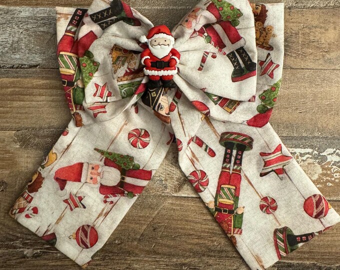 Cream and Red Colored Christmas Santa Claus Fabric Hair Bow with Medium Tail Length on French Barrette, LUKDesignsBoutique