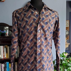 Vintage 70's dagger collar shirt with dark colors and cool geometric design!