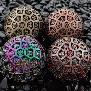 May include: Four spherical, metal dice with intricate, openwork designs. Each die features a different color scheme: bronze, copper, iridescent, and red with blood-like splatters. The numbers 1-100 are visible on each die, perfect for tabletop gaming.