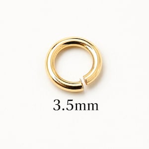 May include: A gold-colored, open jump ring, 3.5mm in size, against a white background. The ring is circular with a smooth, polished surface. The text "3.5mm" is displayed below the ring.