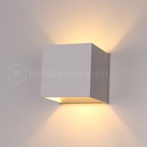 May include: A white square-shaped wall light fixture with a warm white light emanating from the top of the fixture.