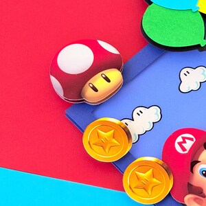 May include: A set of three ceramic mugs with a speckled, matte finish. The mugs are in shades of cream, light gray, and dark gray. Each mug has a simple, minimalist design and a rounded handle.