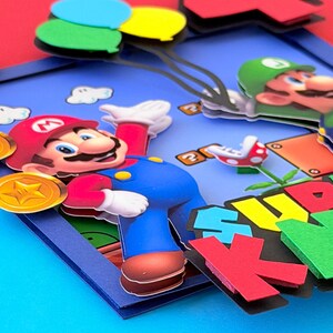 May include: A white ceramic mug with a black handle and the text "But First, Coffee" in a handwritten style. The mug is on a white surface. The mug is approximately 4 inches tall.