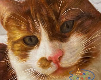 May include: Close-up painting of a cat with brown and white fur. The cat has green eyes and a pink nose. The painting is signed "Hand painted" in the bottom right corner.