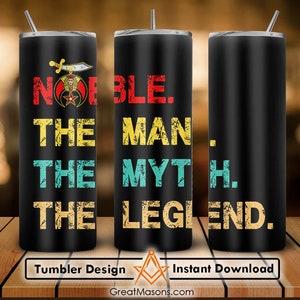 May include: A black tumbler with a distressed design featuring the text "NOBLE. THE MAN. THE MYTH. THE LEGEND." and a Masonic symbol. The tumbler is on a wooden surface.