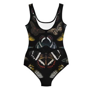 May include: Black one-piece swimsuit with a colorful butterfly print. The swimsuit has a scoop neck and a racerback style.