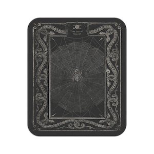 May include: A black and white illustration of a spider's web with a spider in the centre. The web is surrounded by a decorative border of snakes. The text "COME INTO MY PARLOUR" is written above the web.