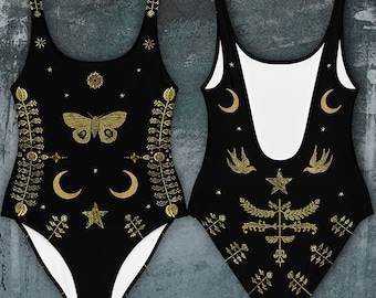 May include: Black one-piece swimsuit with a gold celestial print featuring stars, moons, birds, and a butterfly. The back of the swimsuit has a white lining.