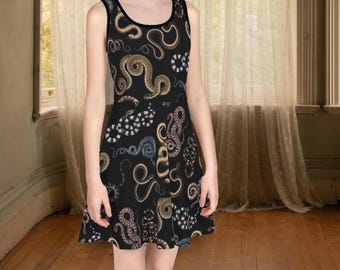 May include: A black skater dress with a colorful snake print pattern. The dress has a sleeveless design and a scoop neck.