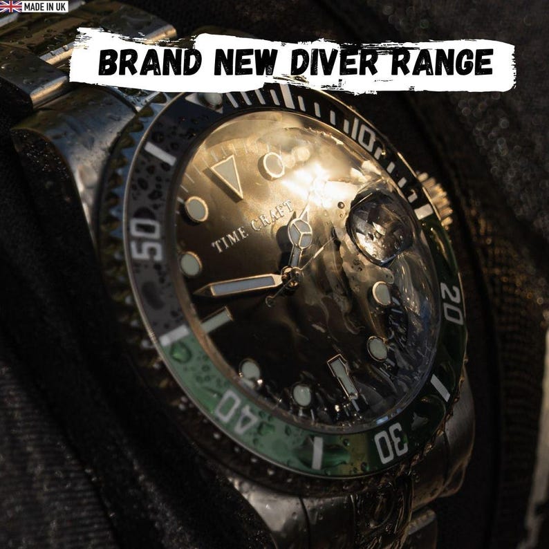 May include: Close-up of a Time Craft diver watch with a black face and a green and black bezel. The watch has silver hands and markers. The text "BRAND NEW DIVER RANGE" is displayed at the top.