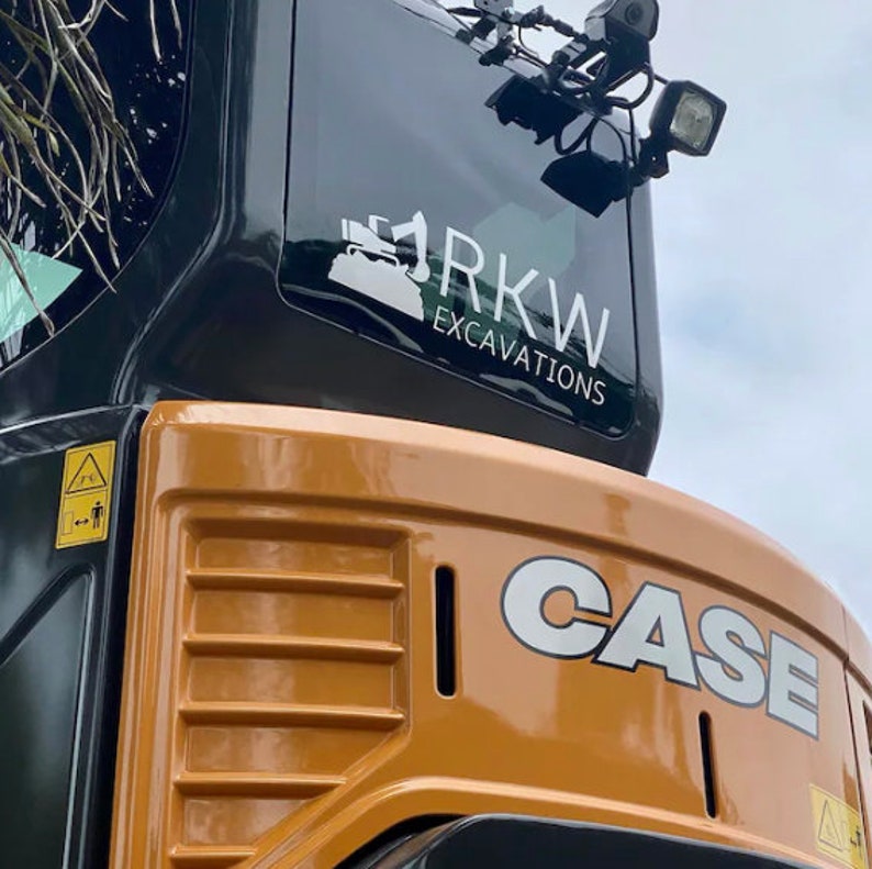 May include: A close-up of a yellow and black excavator with the CASE logo and a sticker that says "RKW Excavations".