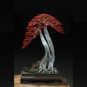 Art Wire Bonsai Tree Sculpture With Red Leaves. The Silver Trunk Made Of Aluminum Wires Braided Into A Block Of Fragrant Jade Driftwood.