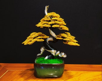 Art Wire Bonsai Tree Sculpture Planted On Pots With Yellow Leaves