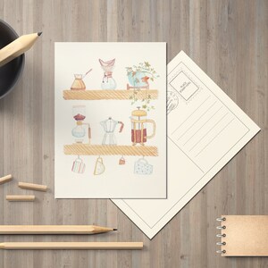 May include: A watercolor illustration of a coffee bar with various coffee brewing methods, including a French press, a pour-over coffee maker, a percolator, and a Moka pot. The illustration features a wooden shelf with hanging mugs and a potted plant.