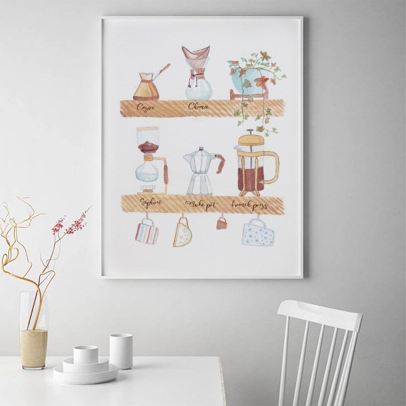 May include: A watercolor illustration of different coffee brewing methods, including a Chemex, French press, Moka pot, and Syphon. The illustration is framed and hanging on a white wall.