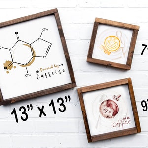May include: Three framed wood signs with coffee-themed illustrations. The largest sign is 13 inches by 13 inches and features a chemical structure of caffeine with a coffee stain. The middle sign is 7 inches by 7 inches and shows a latte with a coffee stain. The smallest sign is 9 inches by 9 inches and shows a cup of coffee with the text "but first, coffee".
