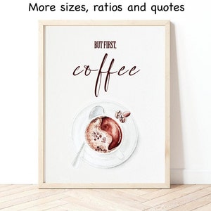 May include: A white framed print with the text "But first, coffee" in brown lettering. The print features a watercolor illustration of a cup of coffee with a spoon and a few coffee beans.