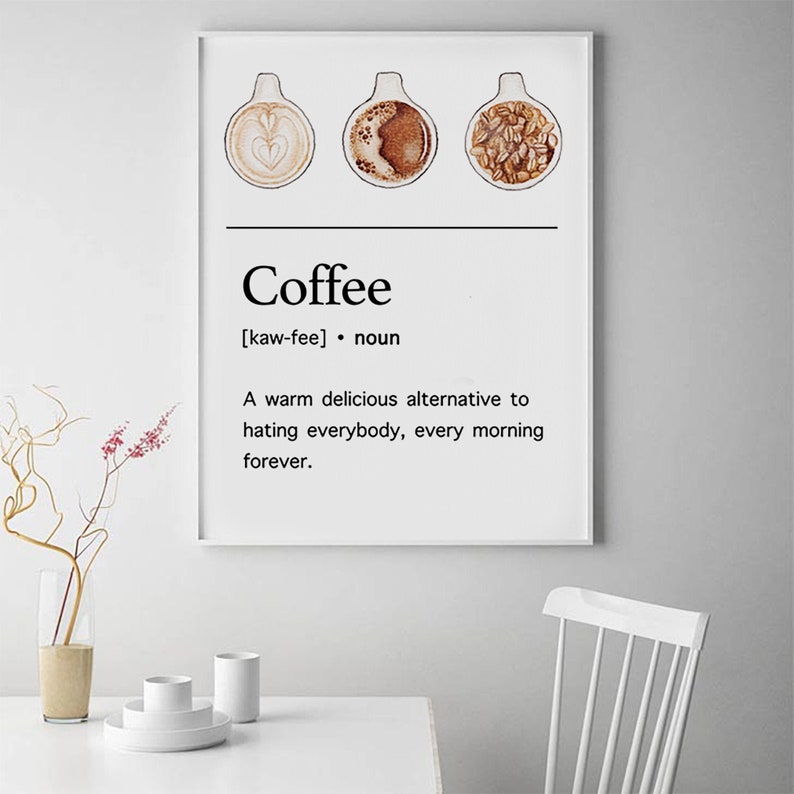 May include: A white poster with a black and white graphic of three coffee cups. The text on the poster reads "Coffee [kaw-fee] noun A warm delicious alternative to hating everybody, every morning forever."