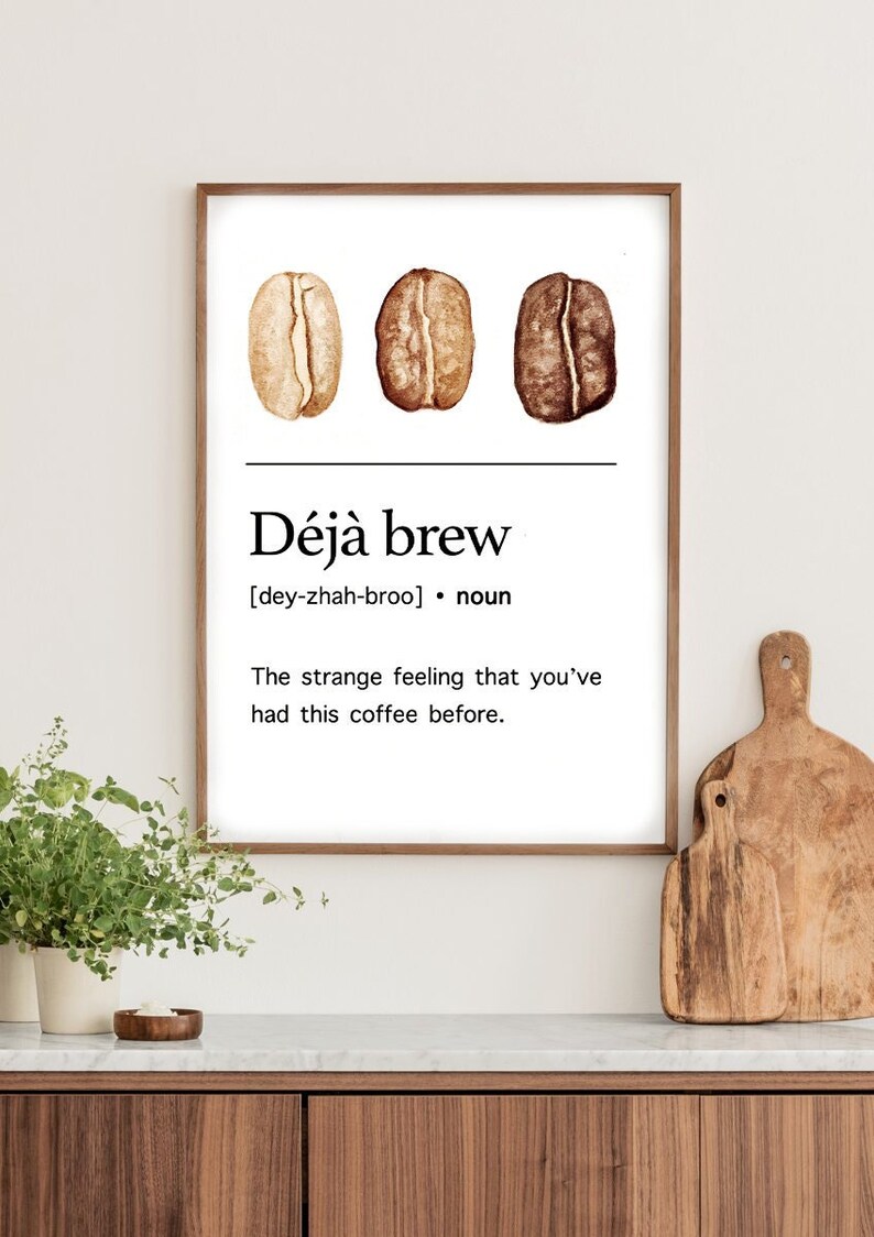 May include: A printable wall art design with three watercolour coffee beans and the text "D&eacute;j&agrave; brew [dey-zhah-broo] noun The strange feeling that you've had this coffee before."