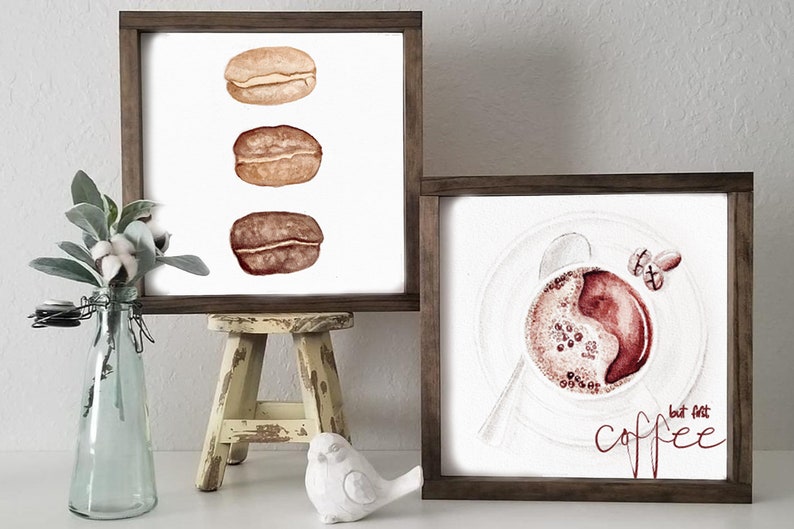 May include: Two framed watercolor paintings. The first painting features three coffee beans in a row. The second painting features a cup of coffee with the text "but first, coffee" in red.