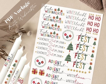 May include: A sheet of white paper with colorful Christmas stickers. The stickers feature festive designs like Christmas trees, ornaments, presents, stars, and text in German. The text includes "Frohe Weihnachten", "Winterlicht", "Schönste Zeit im Jahr", "Advent", and "Fest".