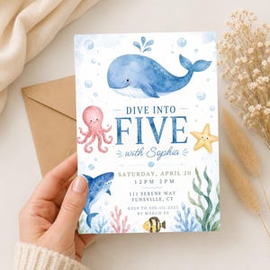 May include: A rectangular invitation card featuring watercolor illustrations of a blue whale, pink octopus, yellow starfish, shark, and fish. The text reads DIVE INTO FIVE with Sophia, Saturday, April 20, 12 PM 2 PM, 111 Serene Way, Funsville, CT, RSVP to 555-111-2323 by March 20.