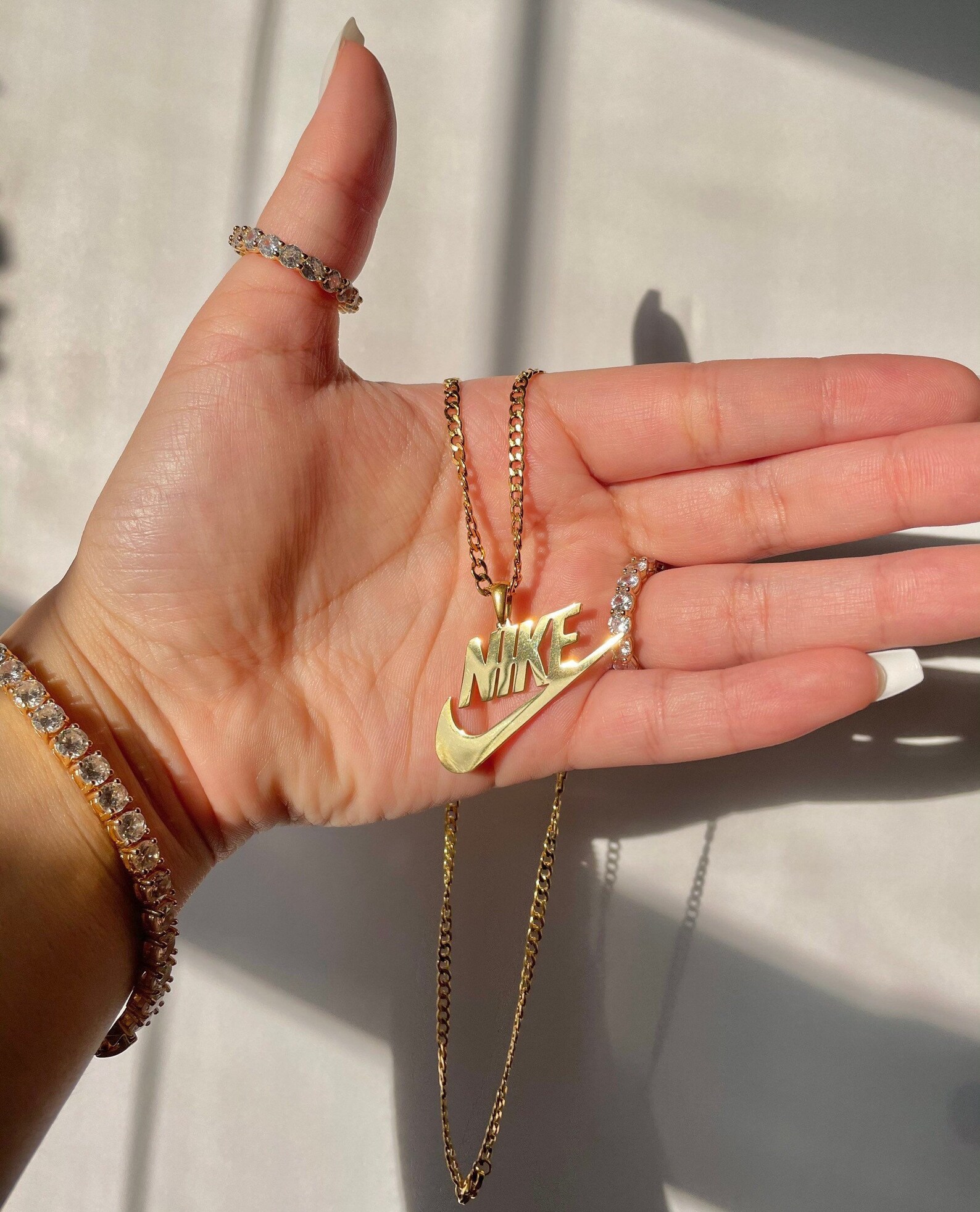 nike pixel with gold chain