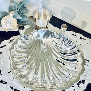 May include: A rustic wooden sign with the text "Welcome" in a handwritten style. The sign is painted white with a distressed finish, and features a decorative floral element in the corner. Perfect for a front door or entryway.