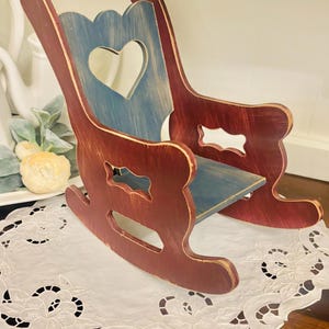 Vintage red and green painted wooden doll rocking chair 14 x 11 x 7"