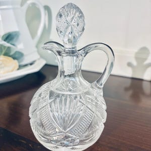 Vintage cut glass vinegar/oil cruet  with stopper with handle (chip on stopper)