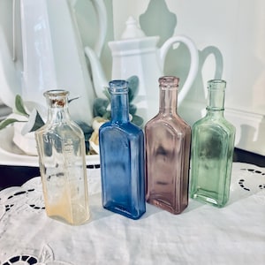 Lot of Vintage colored glass bottle medicine bottle pharmacy bottle purple blue green set of 4