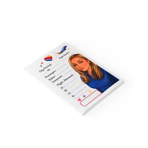 May include: A rectangular notepad featuring a cartoon illustration of a flight attendant in a blue uniform. The page includes fields for City Pairing, Passenger, Babies, Jumpseats, and Flight Attendant, decorated with a small airplane and hearts.