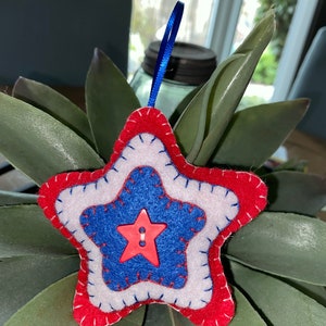 Red white and blue star ornament with red star in center