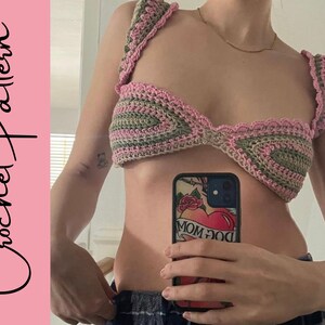 May include: A crocheted pink and green bikini top with a scalloped edge.