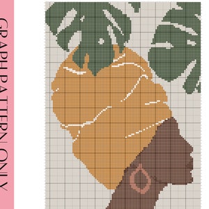 May include: Cross stitch pattern featuring a woman with a brown head wrap and large gold earrings. The woman is surrounded by green leaves.